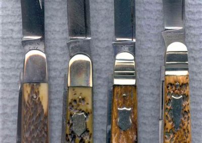 "Left to right: Queen City, English jack, 2 blade, Rogers bone handles, iron liners and bolsters, no etch, block QUEEN CITY tang stamp, 4-1/2”, Schatt & Morgan, English jack, 2 blade, bone handles w/federal shield, brass liners, NS bolsters, no etch, block SCHATT & MORGAN CUTLERY CO TITUSVILLE PA tang stamp, 4-1/2”, Schatt & Morgan, English jack, 2 blade, bone handles w/federal shield, brass liners, NS bolsters, no etch, X w/wings S M TITUSVILLE tang stamp, 4-1/2”, Schatt & Morgan, English jack, 2 blade, bone handles w/arrowhead shield, brass liners, NS bolsters, no etch, SCHATT & MORGAN CUTLERY CO TITUSVILLE PA tang stamp, 4-1/2”