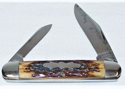 "Queen City, equal-end jack, 2 blade, jigged bone handles w/propeller shield, brass liners, NS bolsters, hammered pins, 3 5/8""
