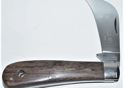 "#1, Queen, pruning or hawkbill, one 3” blade, rosewood handles, brass liners, NS bolsters, Queen Steel #1 Made in U.S.A. etch, QUEEN tang stamp, 4-1/8”"