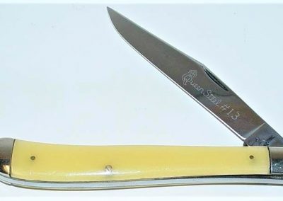 "#13, Queen, utility, 1 blade, amber handles, brass liners, NS bolsters, Queen Steel #13 etch, Q STEEL tang stamp, 4-1/8”"