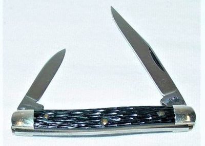 "#43, Queen, small serpentine, 2 blade, rough black imitation bone handles, brass liners, NS bolsters, no etch, big Q tang stamp, 2-5/8”"
