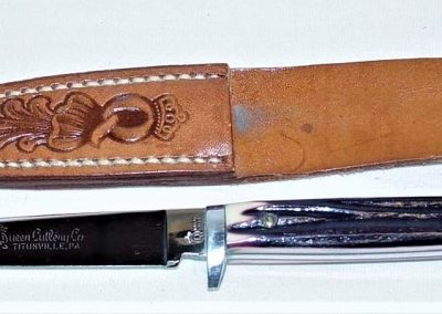 "#79, Queen, hunting knife, burnt orange imitation Winterbottom bone handles, script Queen Cutlery Co. TITUSVILLE, PA etch, QUEEN STEEL tang stamp, 3-3/4”"