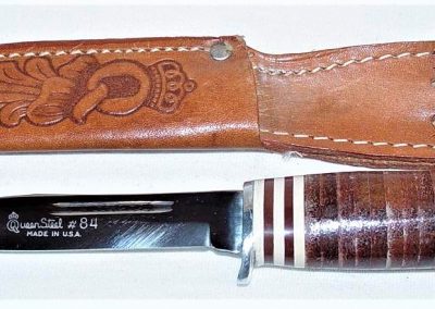 "#84, Queen, hunting knife, stacked leather handles, script Queen Steel #84 Made in U.S.A. etch, no tang stamp, 4-1/4”"