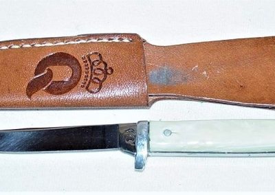"#85, Queen, hunting knife, imitation ivory handles, no etch, Q tang stamp, 3”"