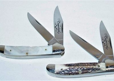 "The Copperhead Set, Top: 2 blade, pearl handles, brass liners, NS bolsters, The Copperhead 1 of 500 etch, Q81 tang stamp, 6-3/8”. Bottom: 2 blade, stag handles, brass liners, NS bolsters, The Copperhead 1 of 500 etch, Q81 tang stamp, 6-3/8”. Could be bought individually or as a set w/matching serial numbers. All knives are numbered."