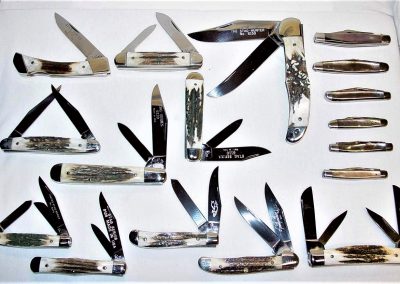 "Queen: This display of eleven Queen stag handle knives and six Queen smoked pearl handle knives represent all recent Queen patterns that were made with these natural materials."