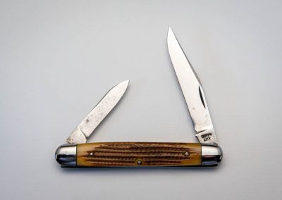 "Queen City, equal end jack, 2-blade, early Winterbottom bone handles, steel liners, NS bolsters, Queen City block stamp, 3 3/8”"