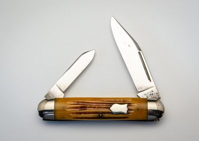 "Queen City, cigar jack, 2-blade, Winterbottom bone handles, brass liners, NS bolsters and federal shield, Queen City block stamp, 4 1/4”"